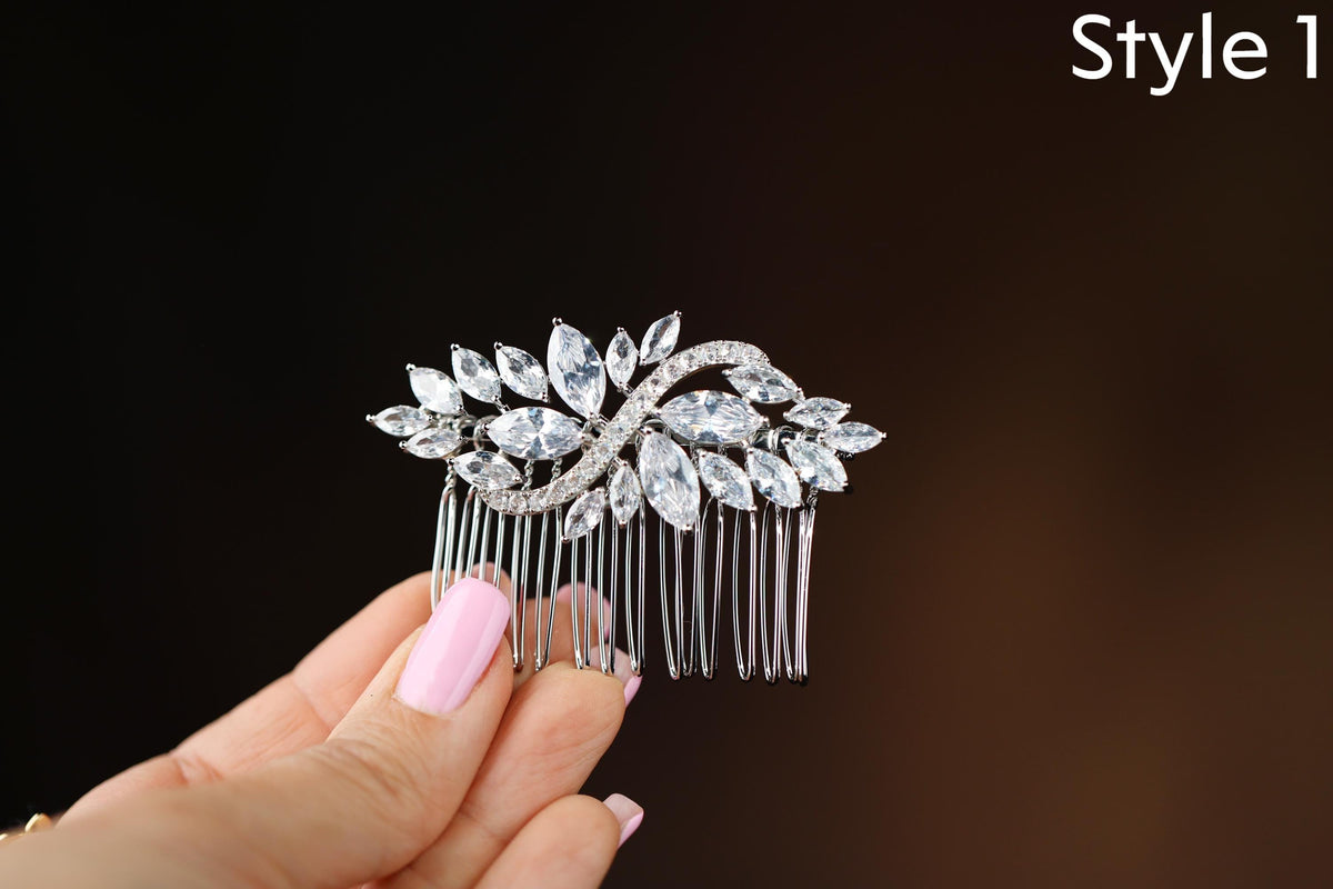 a close up of a person holding a hair comb