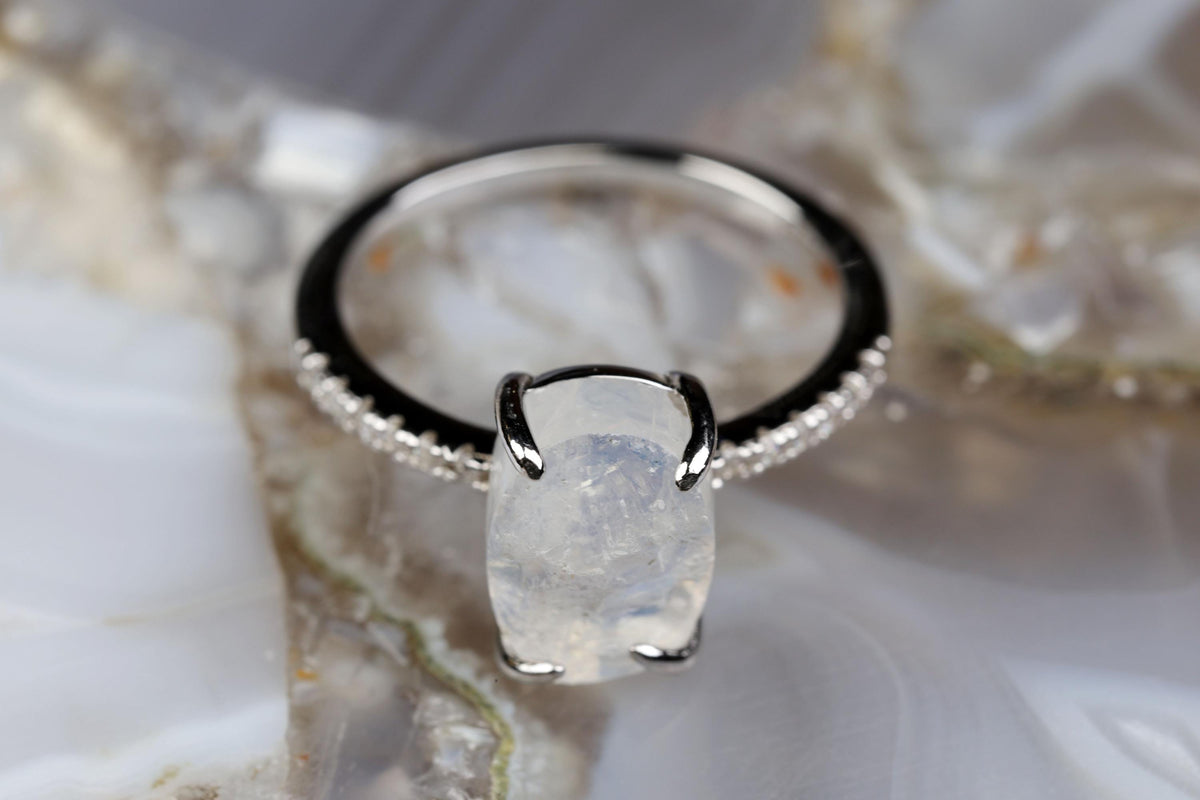 a close up of a ring with a stone on it