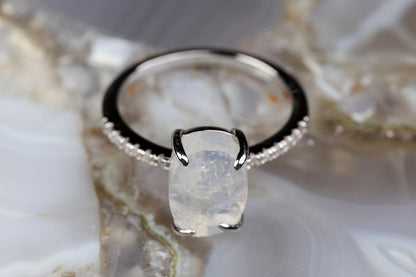 a close up of a ring with a stone on it
