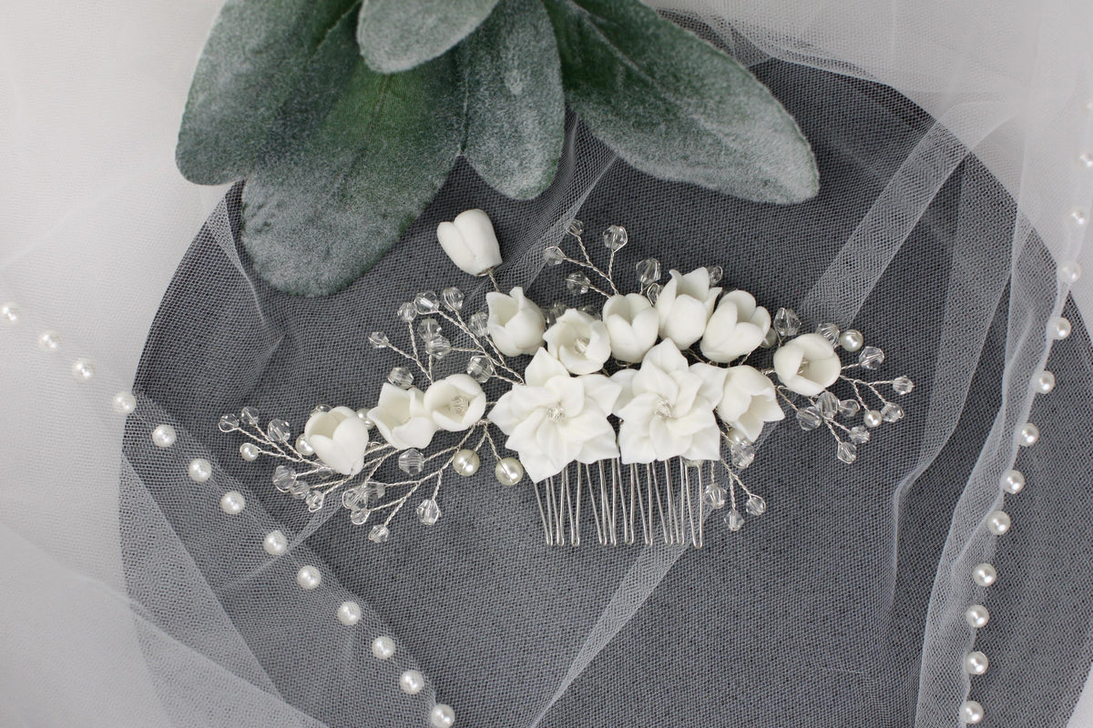 a bridal hair comb with flowers and pearls