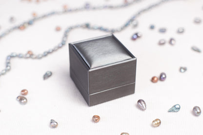 a small metal box sitting on top of a table