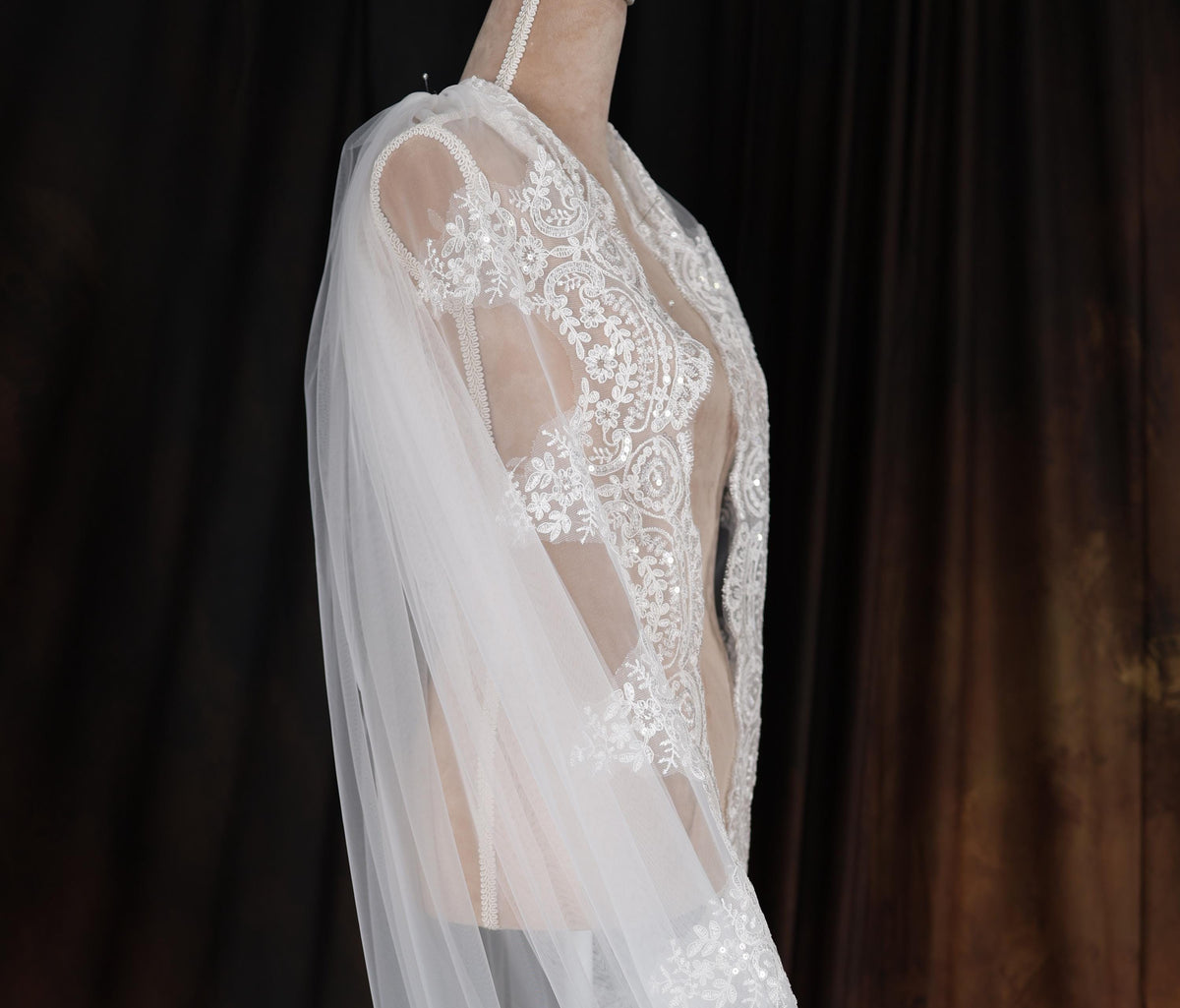 a woman wearing a wedding dress and veil