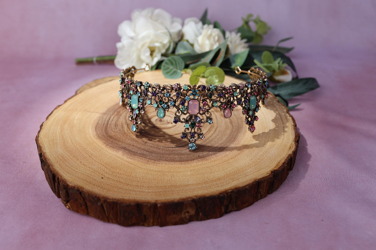 a piece of wood with a necklace on it