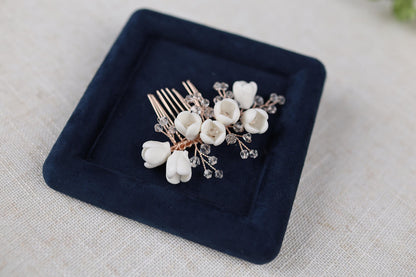 a close up of a hair comb with flowers on it