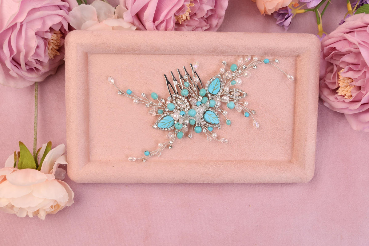 a close up of a hair comb with flowers in the background