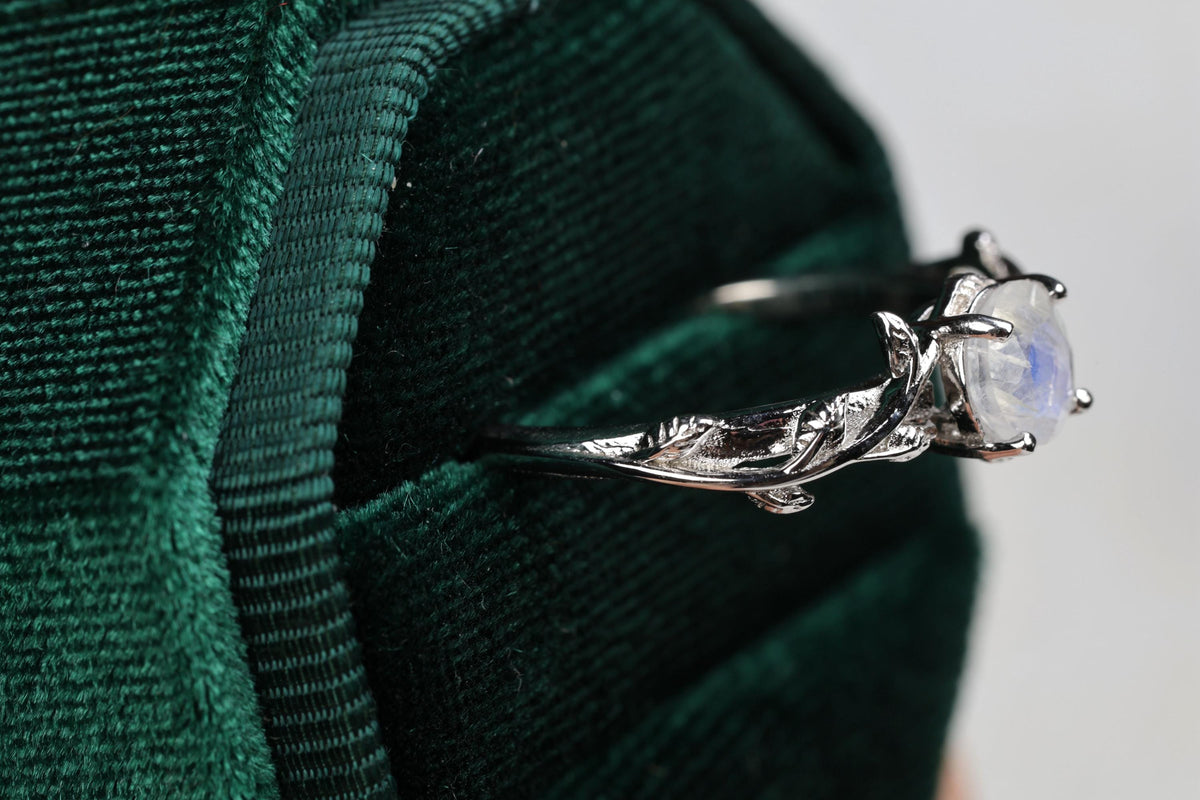 a close up of a ring with a stone on it