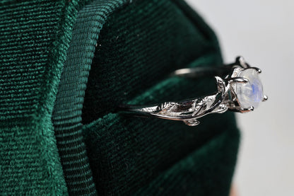 a close up of a ring with a stone on it