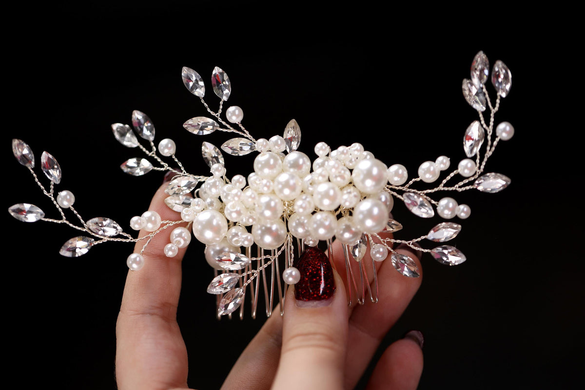 a close up of a person holding a hair comb