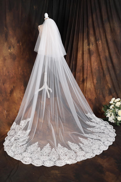 a wedding veil on a mannequin in front of a backdrop