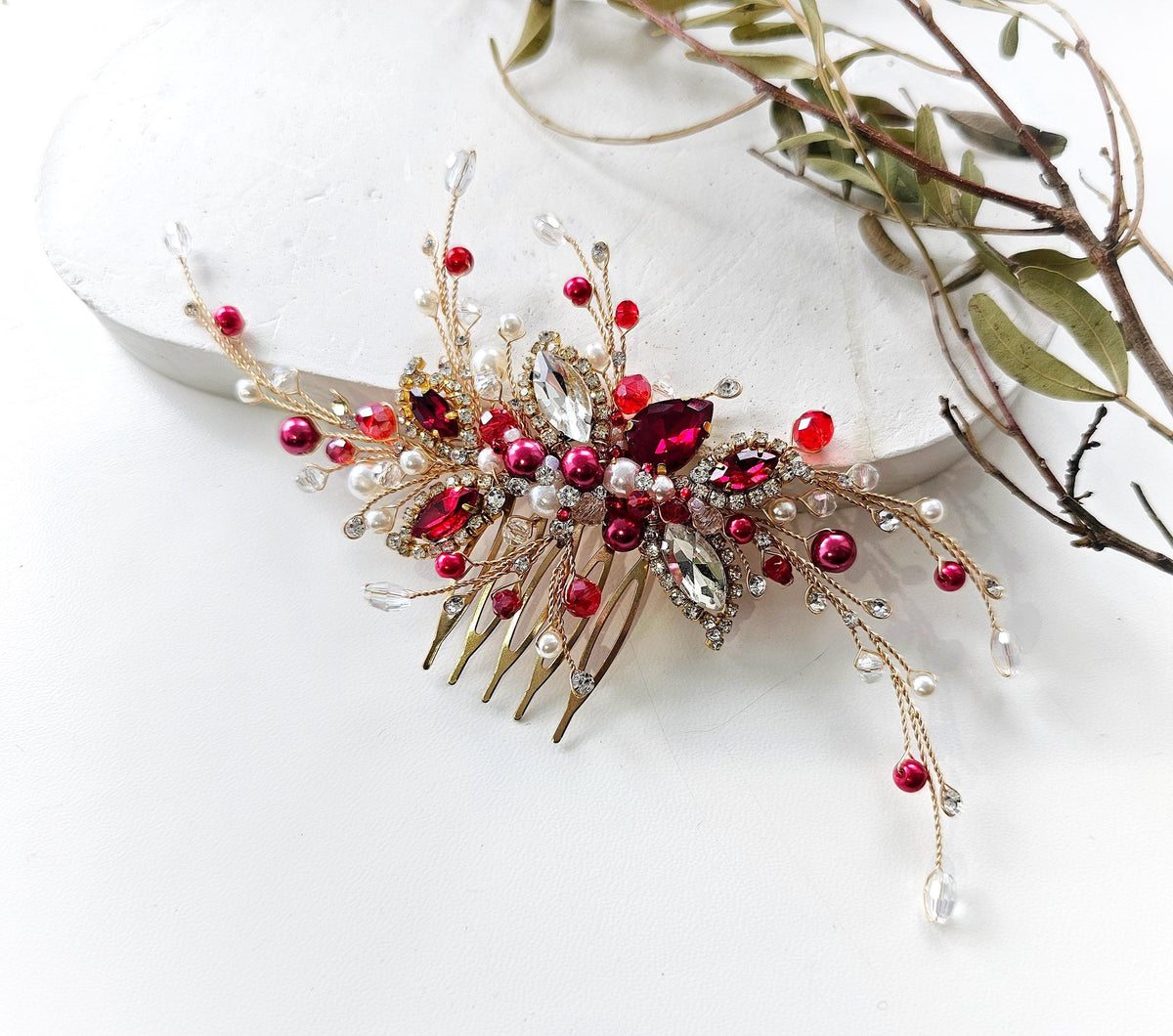 a hair comb with red and white beads