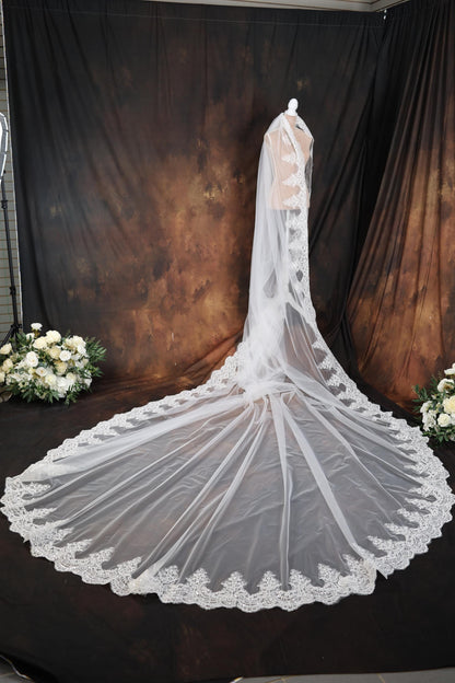 a bridal veil on display in front of a backdrop