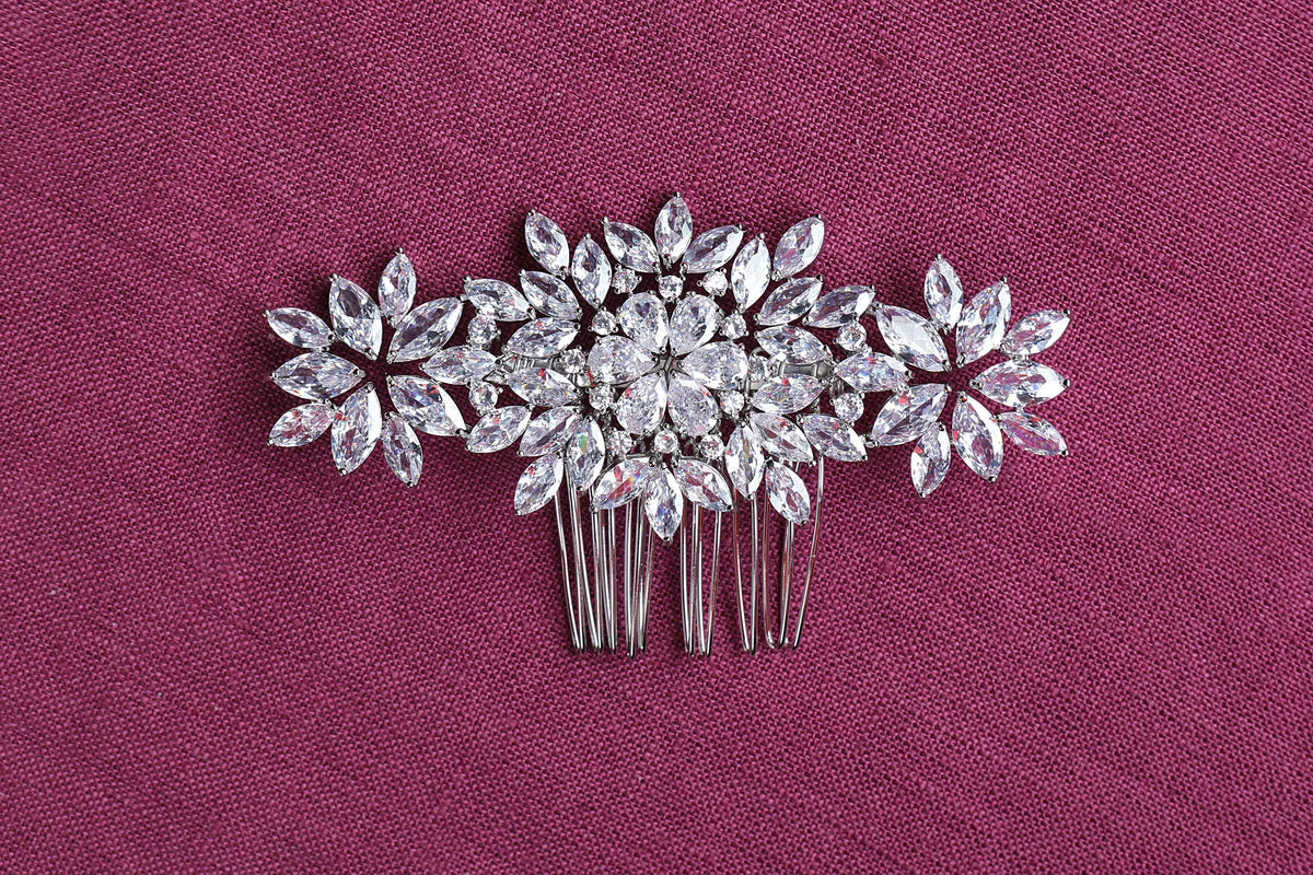 a close up of a hair comb with flowers on it