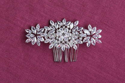 a close up of a hair comb with flowers on it