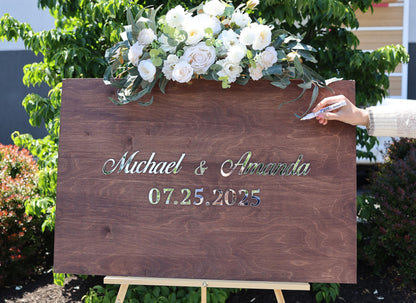 a wooden sign with a bouquet of flowers on top of it