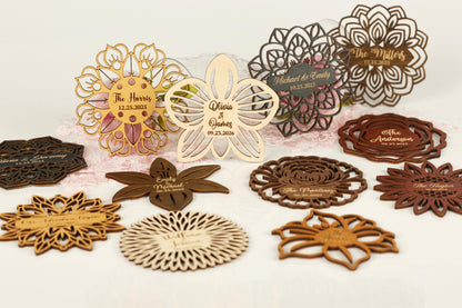 a collection of wooden coasters and nameplates, each with unique designs and text.