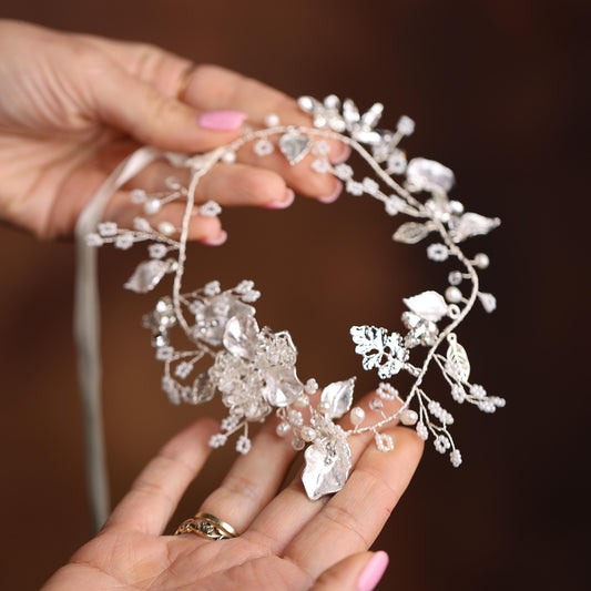 a close up of a person holding a tiara