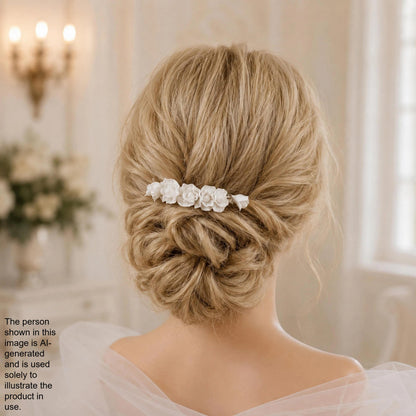 a woman's back view with her hair styled in a bun, adorned with a decorative hair accessory featuring white flowers.
