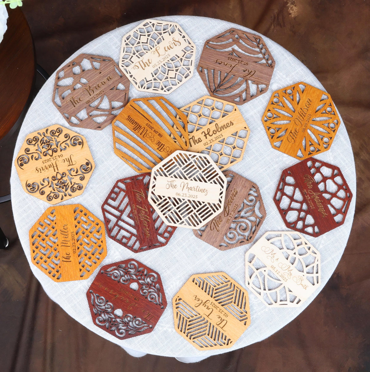 a white table topped with lots of cut out pieces of paper