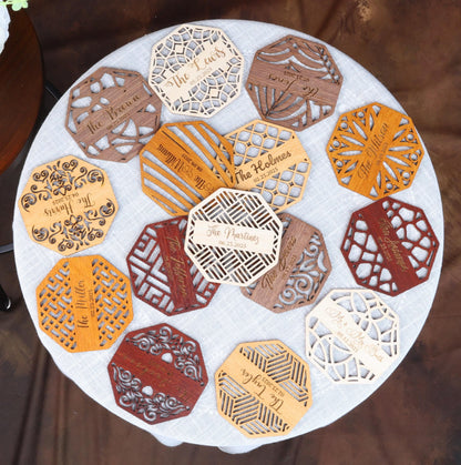 a white table topped with lots of cut out pieces of paper