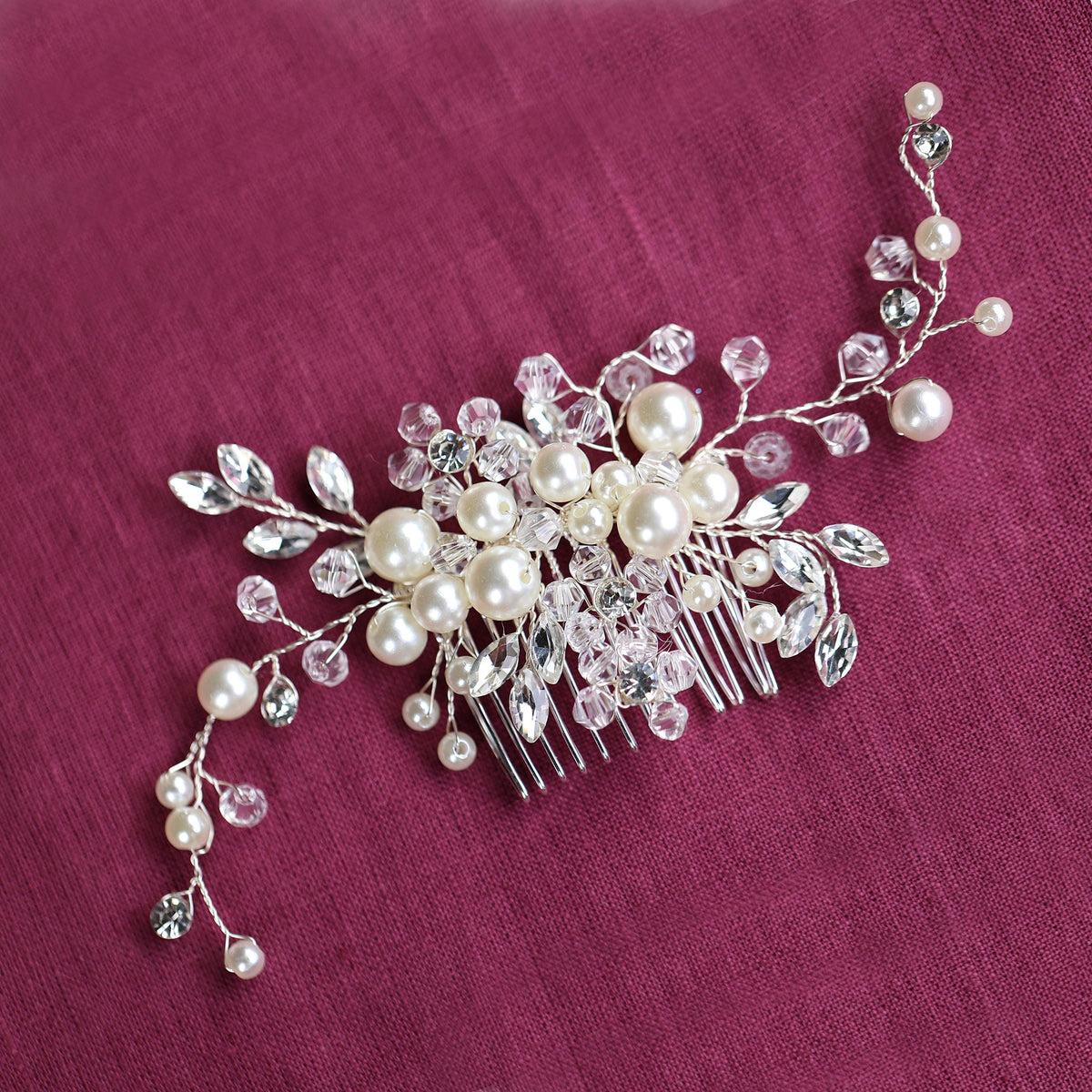 a close up of a hair comb with pearls