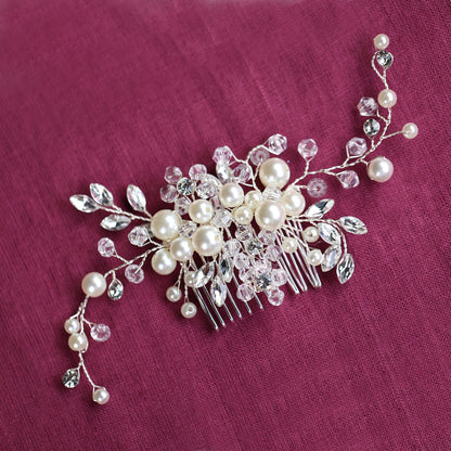 a close up of a hair comb with pearls