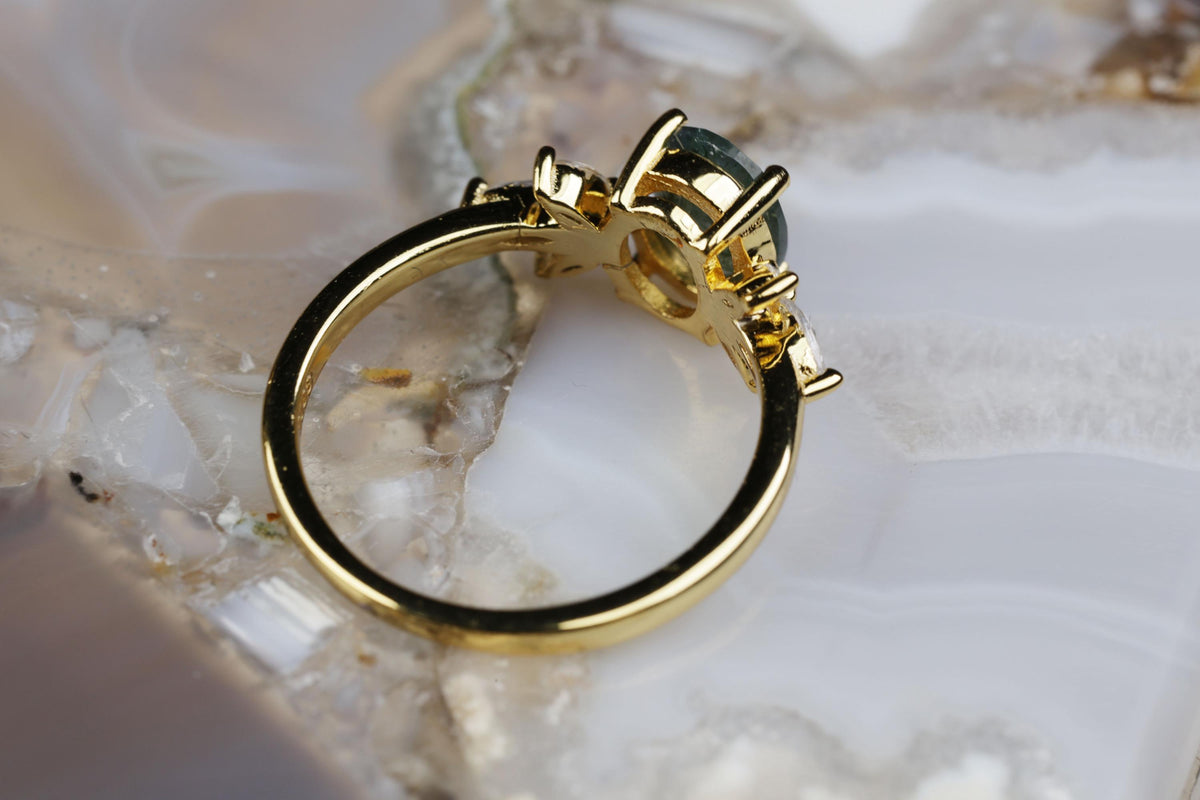 a close up of a ring on a rock