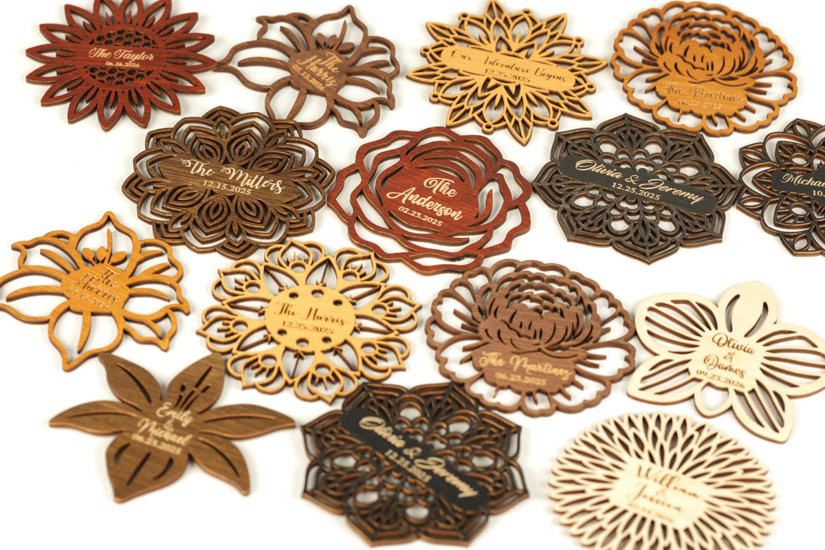 a collection of wooden coasters or magnets with various floral designs and text.