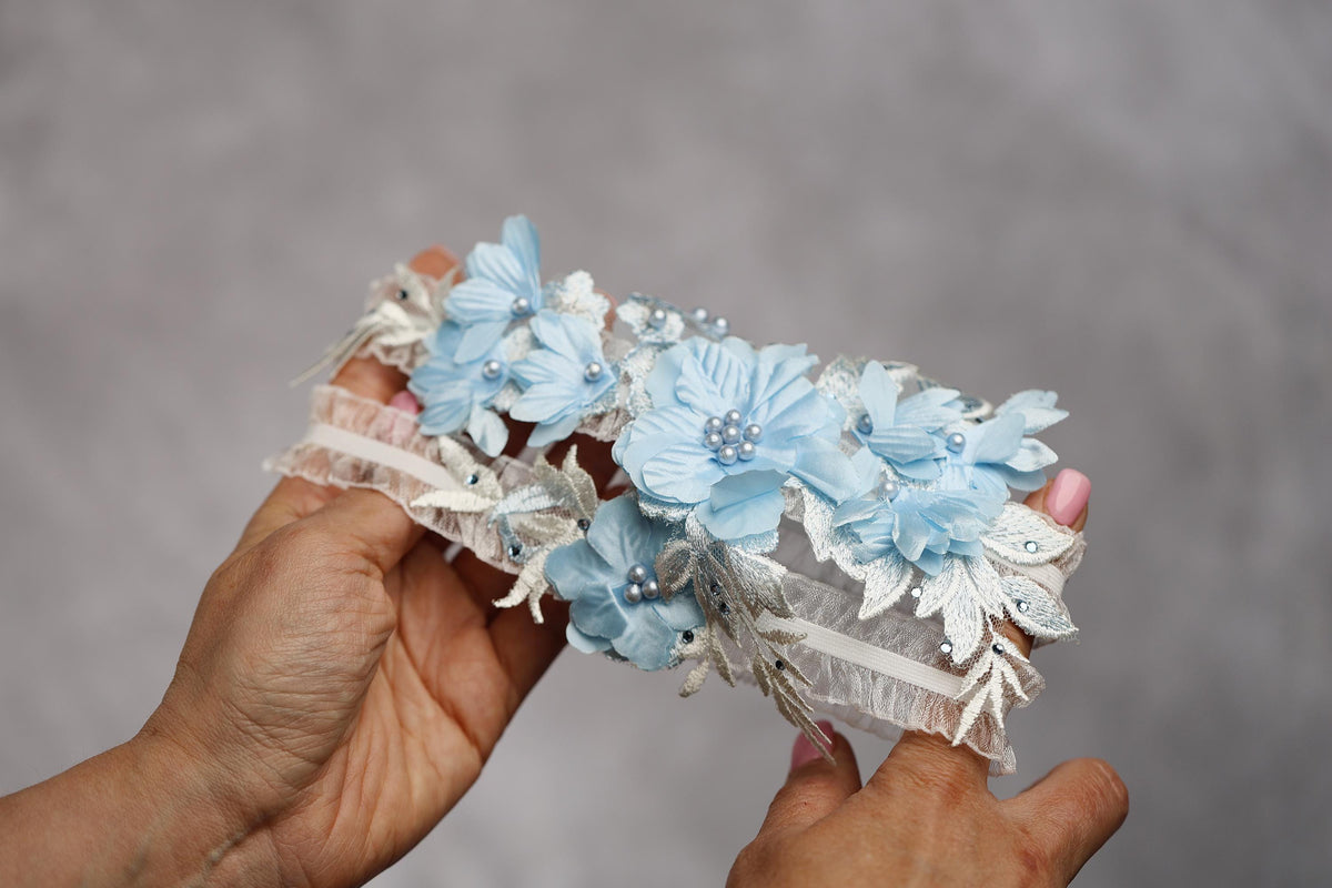 a person holding a bouquet of flowers in their hand