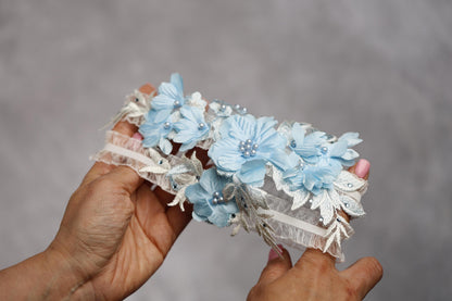 a person holding a bouquet of flowers in their hand