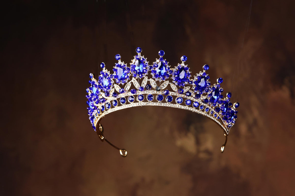 a tiara with a lot of blue stones on it