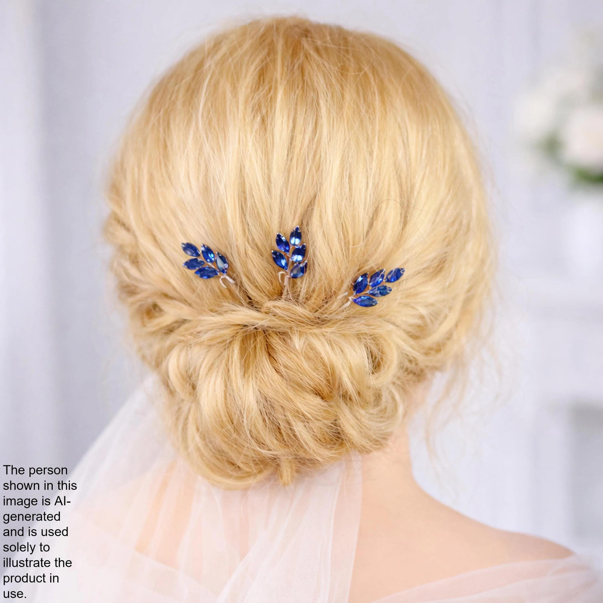 a close-up view of a woman's blonde hair with three blue floral hair clips.