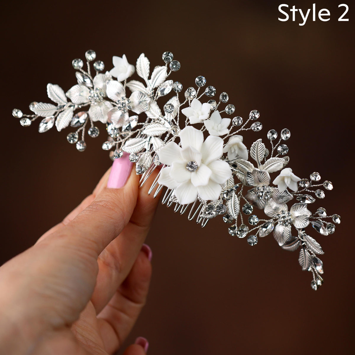 a close up of a person holding a hair comb