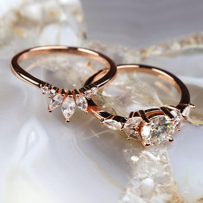 a couple of wedding rings sitting on top of a table