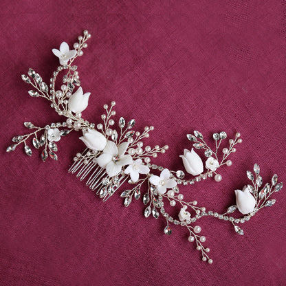 a bridal hair comb with flowers and pearls