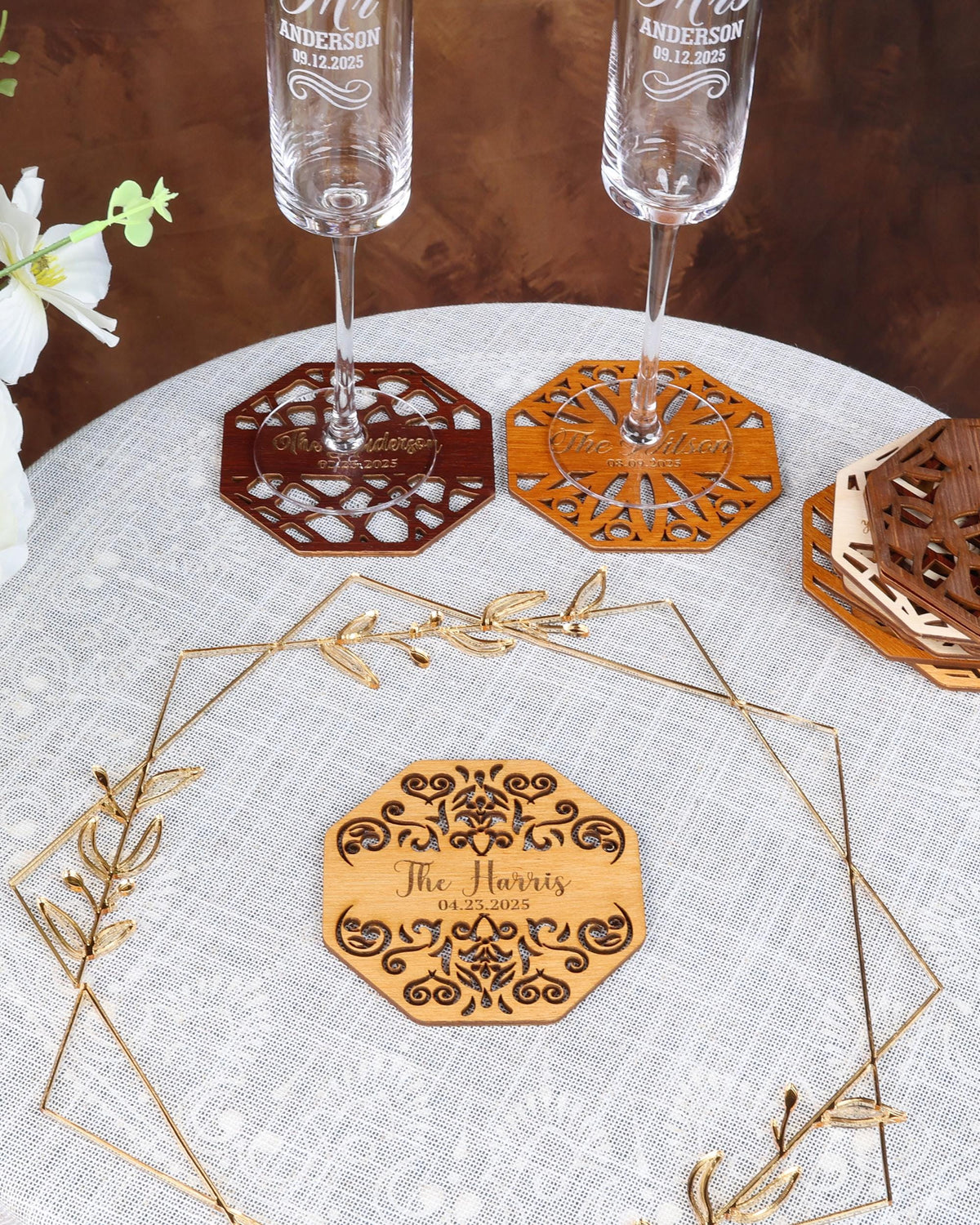 a white table topped with three wine glasses