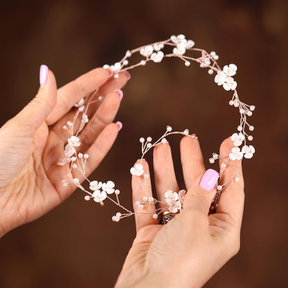 a close up of two hands holding a tiara