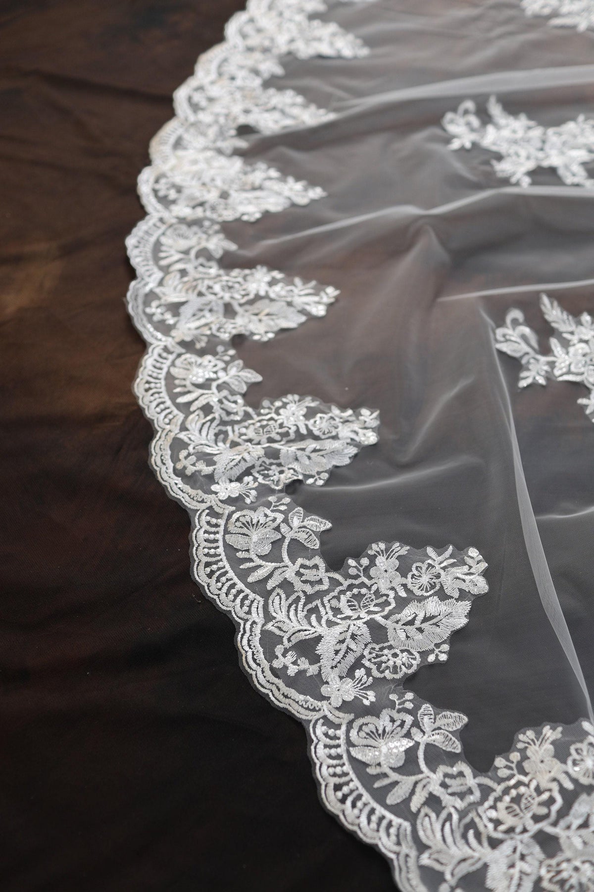 a close up of a wedding veil on a table