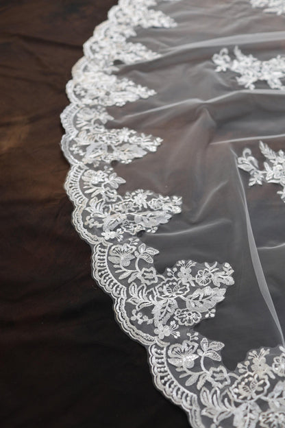 a close up of a wedding veil on a table