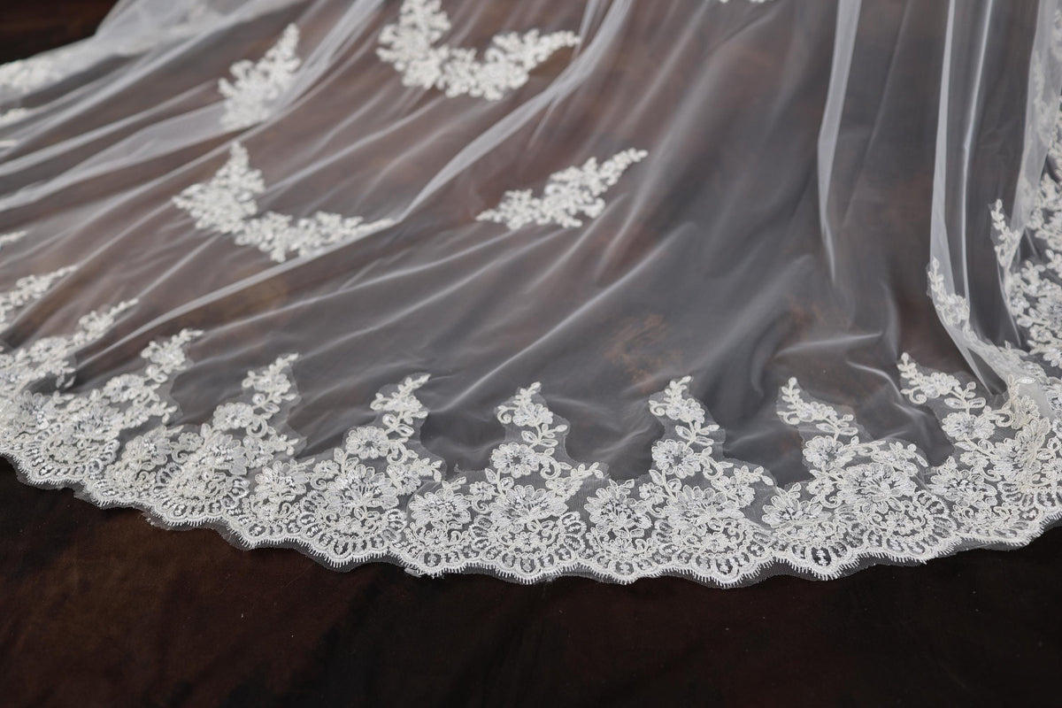 a close up of a wedding veil on a table