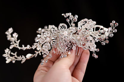 a hand holding a piece of crystal jewelry