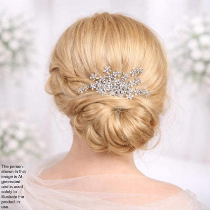 the back view of a woman's blonde hair with a decorative hair accessory, such as a flower or crystal piece, pinned to the side.