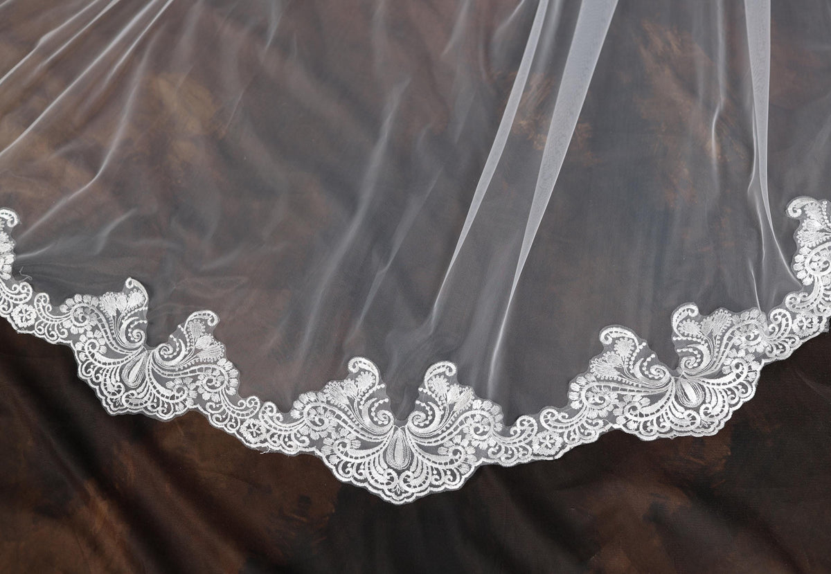 a close up of a wedding veil on a table