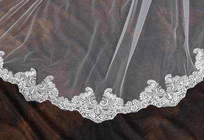 a close up of a wedding veil on a table