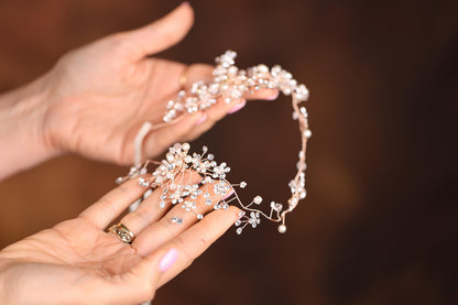 a close up of a person holding a tiara