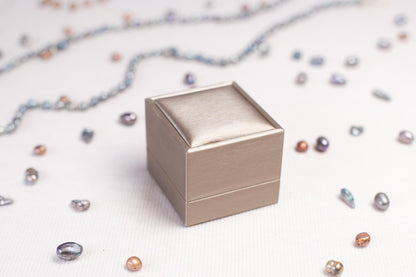 a silver box sitting on top of a table