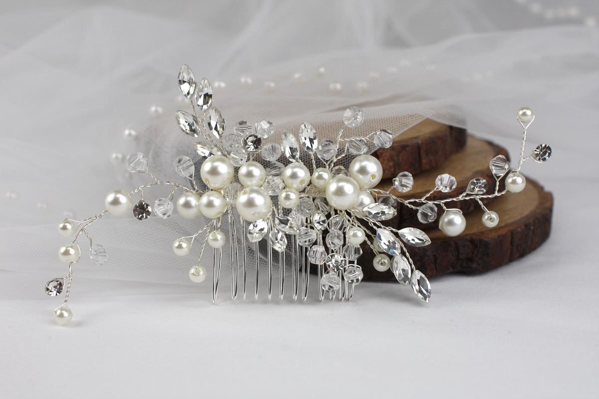 a close up of a hair comb with pearls