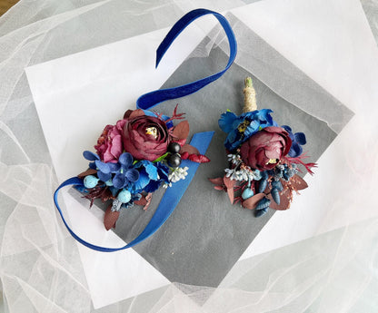 a couple of flowers on top of a piece of paper