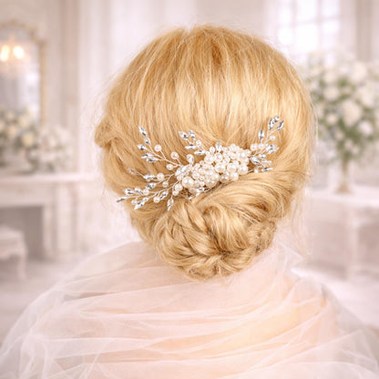 A close-up of a woman's blonde hair with a decorative hair accessory, such as a flower or crystal piece, in the back of her head.