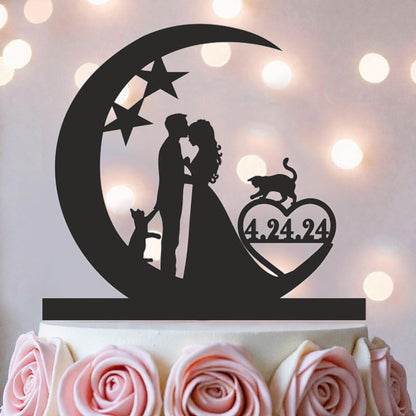 A silhouette of a couple embracing under a crescent moon, with a cat and a heart-shaped symbol with the date "4.24.94" displayed on it, all set against a background of pink roses.