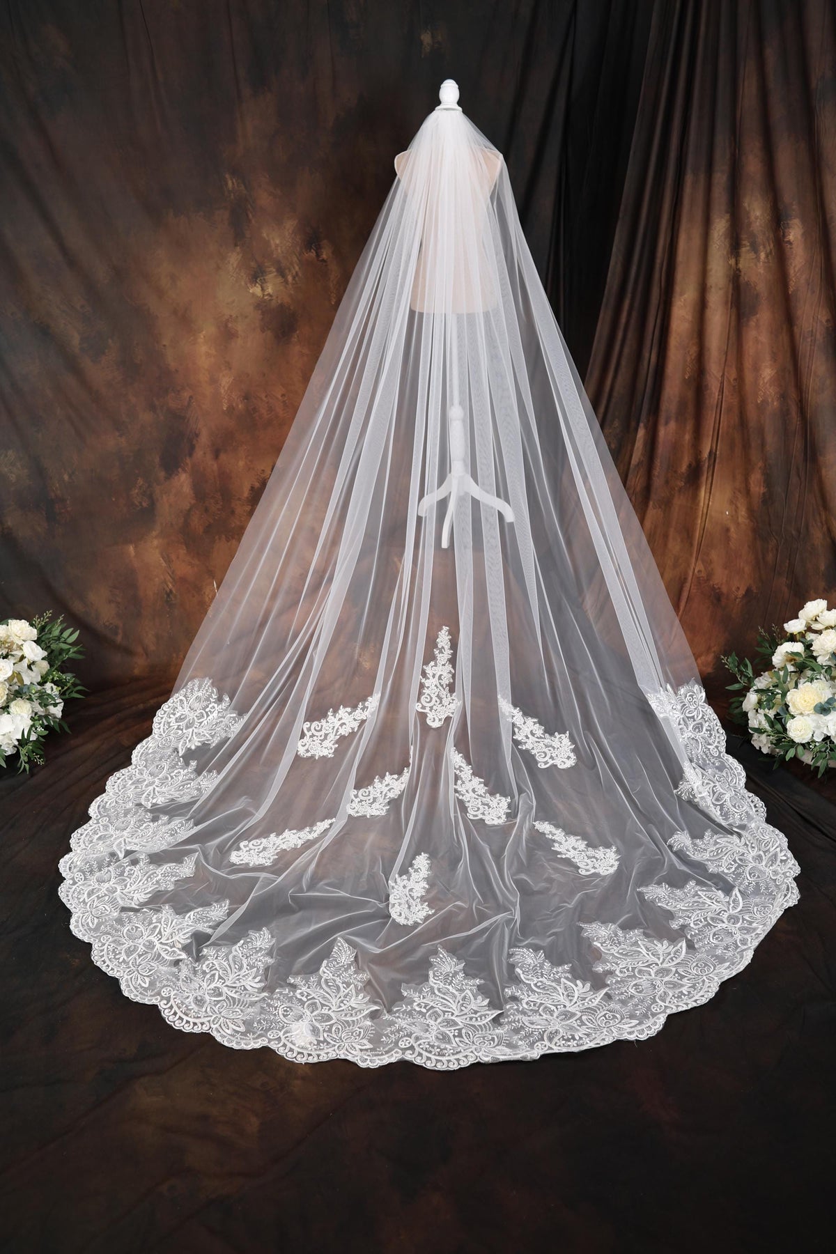 a wedding veil with flowers on it